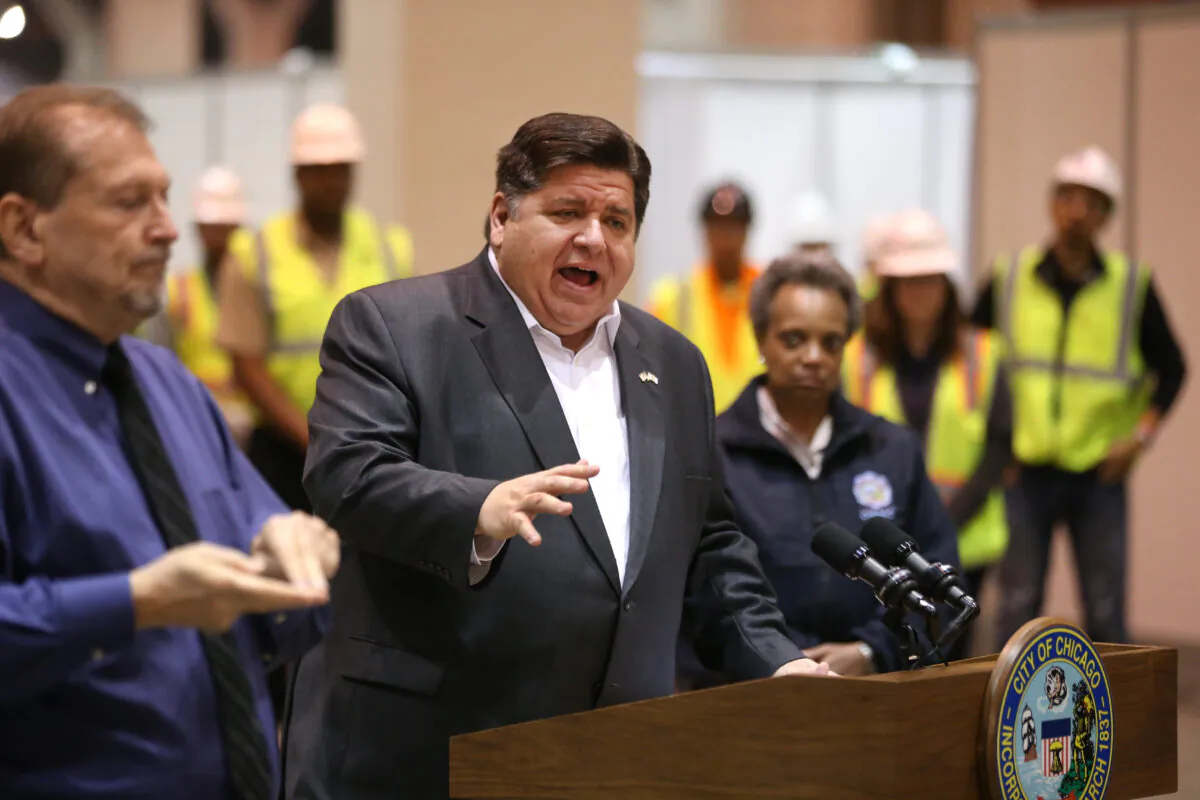 Illinois Gov. J.B. Pritzker (C) speaks during a press conference in Chicago on April 3, 2020. Out of the 50 states, Illinois ranks 49 in financial health. (Chris Sweda-Pool via Getty Images)