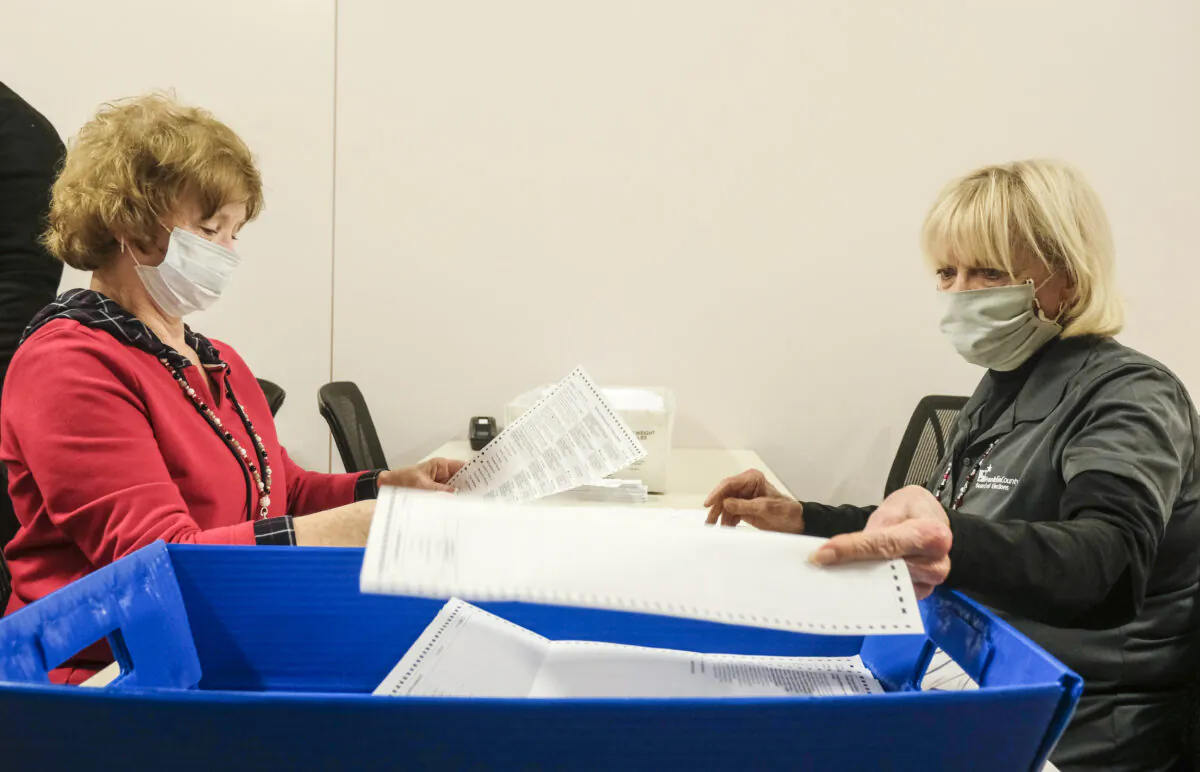 Employees and volunteers of the Franklin County Board of Elections sort through and de-stub both mail-in ballots and provisional ballots in Columbus, Ohio, on April 28, 2020.   (Matthew Hatcher/Getty Images)