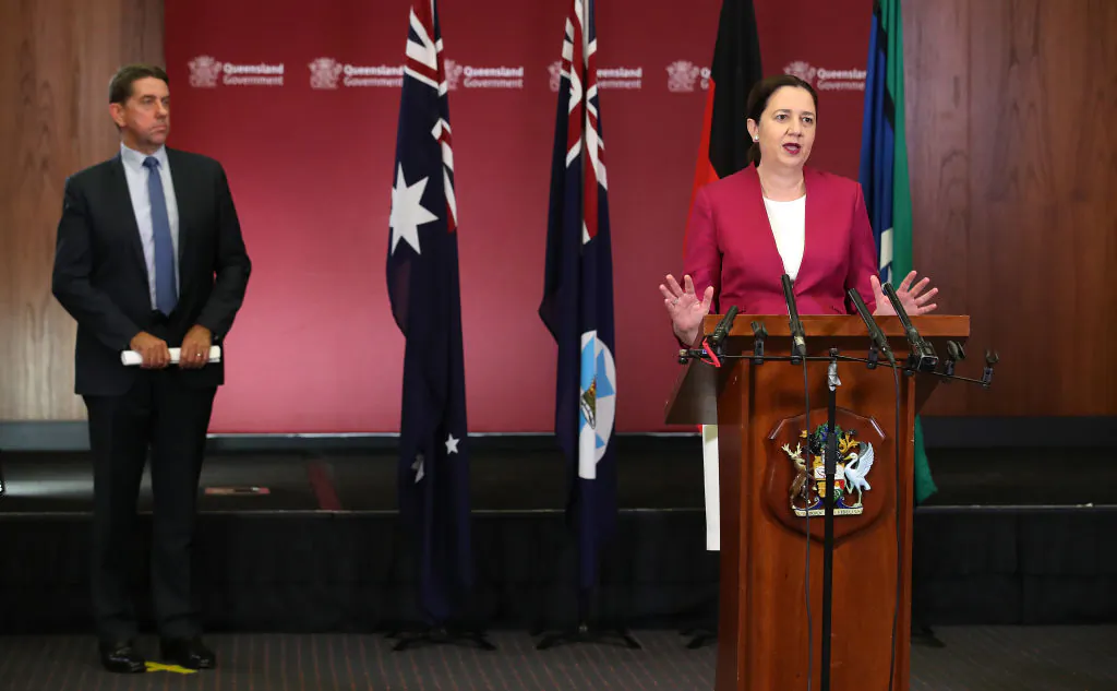 Queensland Premier Annastacia Palaszczuk (R) attends a press conference at parliament house as Minister Cameron Dick looks on, on March 25, 2020 in Brisbane, Australia. (Jono Searle/Getty Images)
