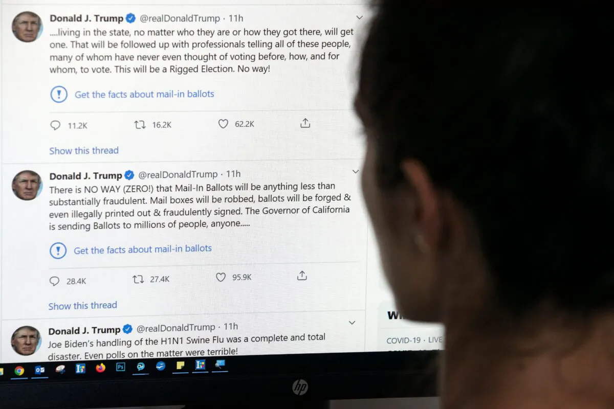 An editor in Los Angeles looks at the official Twitter account of President Donald Trump on May 26, 2020. (AFP via Getty Images)