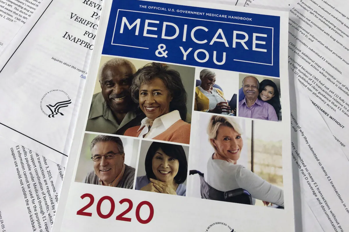 The official U.S. Government Medicare Handbook for 2020 over pages of a Department of Health and Human Services, Office of the Inspector General report, are shown, in Washington on Feb. 13, 2020. (Wayne Partlow/AP Photo)