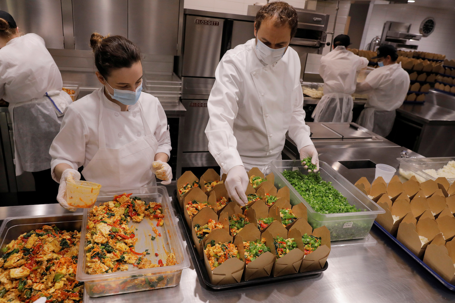 daniel humm and staff prepare food donation boxes in the kitchen of eleven madison park