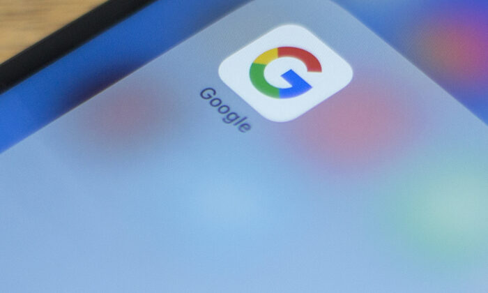 Google's logo on a phone in a photo illustration on July 10, 2019. (Alastaire Pike/AFP via Getty Images)