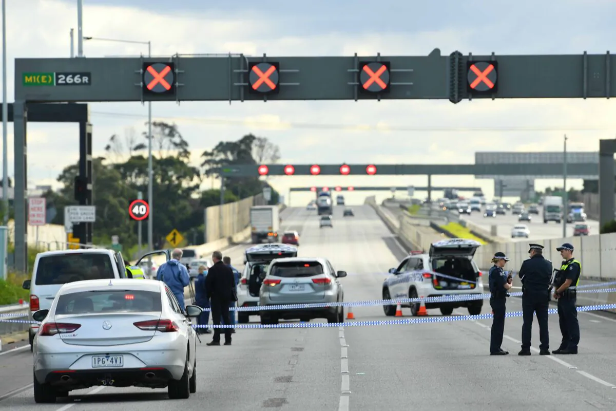 Victorian Police officers attend the scene of a shooting along the Monash Freeway in Melbourne, Australia, on May 28, 2020. (AAP Image/James Ross)