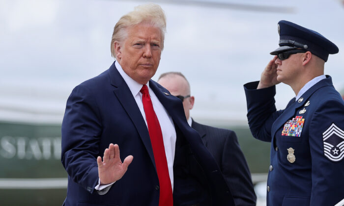 President Donald Trump boards Air Force One as he departs Washington for travel to the Kennedy Space Center in Florida at Joint Base Andrews, Md., on May 27, 2020. (Jonathan Ernst/Reuters)