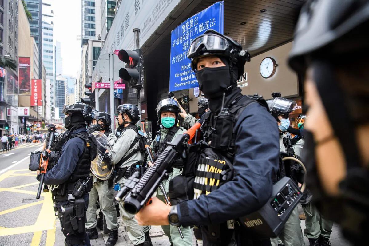 Riot police take part in a crowd dispersal operation in the Central district of Hong Kong on May 27, 2020. (Anthony Wallace/AFP via Getty Images)