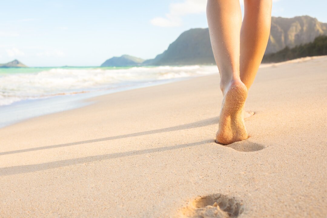 Something beckons us to leave footware behind when a soft welcoming beach lays out before us. (KieferPix/Shutterstock)