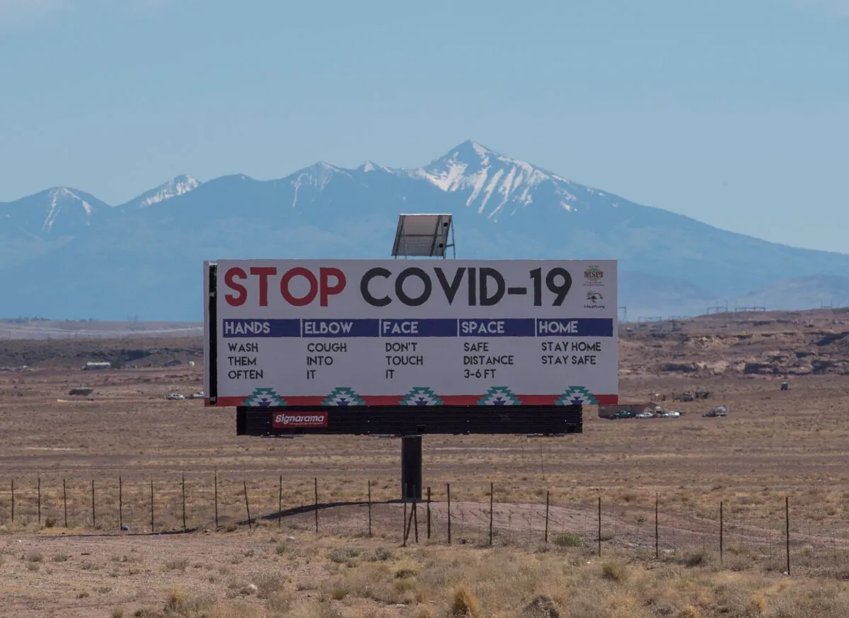 A sign warns against COVID-19 near Tuba City, AZ, on May 24, 2020. (Mark Ralston/AFP/Getty Images)
