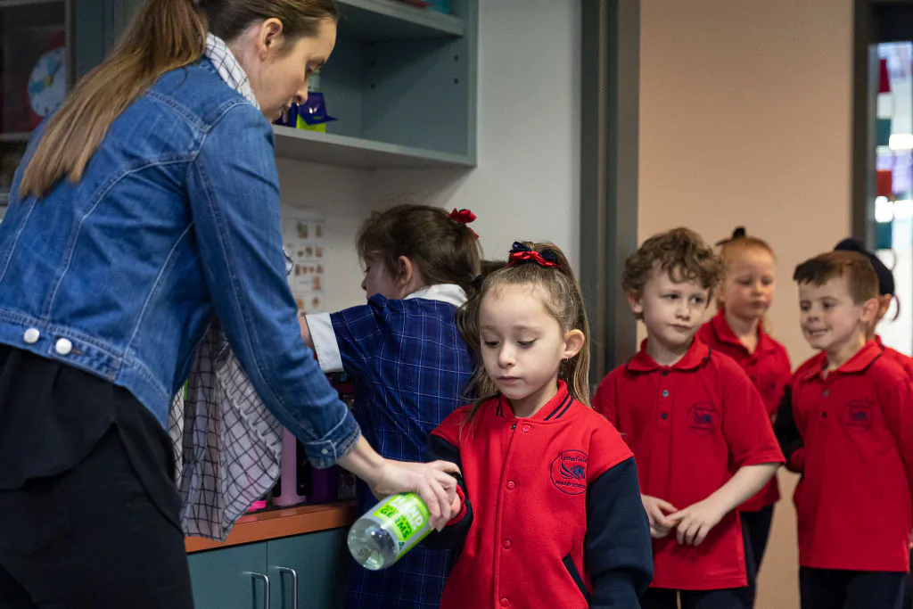 Students sanitize at Lysterfield Primary School on May 26, 2020 in Melbourne, Australia. (Daniel Pockett/Getty Images)