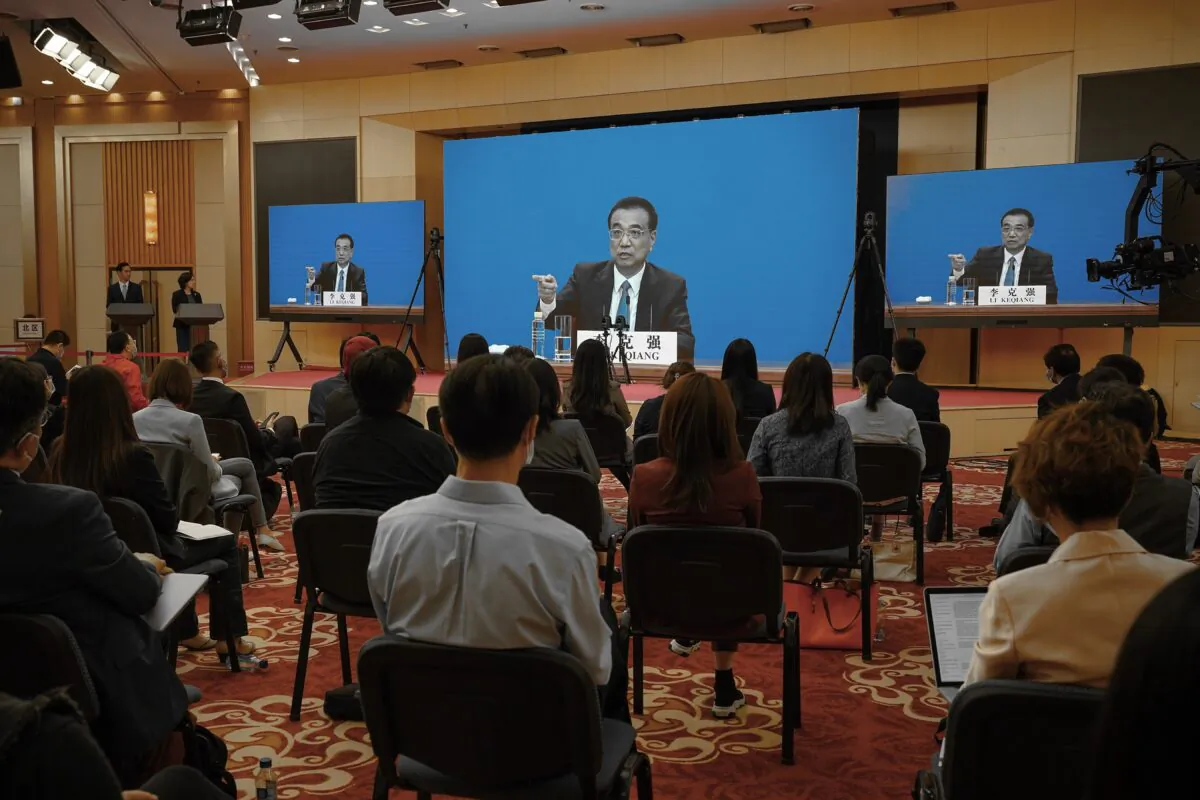 Chinese Premier Li Keqiang speaks at the video press conference from The Great Hall Of The People after the closing of the rubber-stamp legislative annual meeting in Beijing, China on May 28, 2020. (Andrea Verdelli/Getty Images)