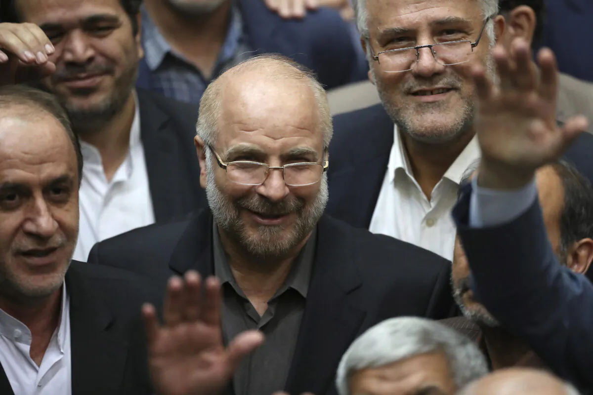Mohammad Bagher Ghalibaf (C) is surrounded by a group of lawmakers after being elected as speaker of the parliament, in Tehran, Iran, on May 28, 2020. (Vahid Salemi/AP Photo)