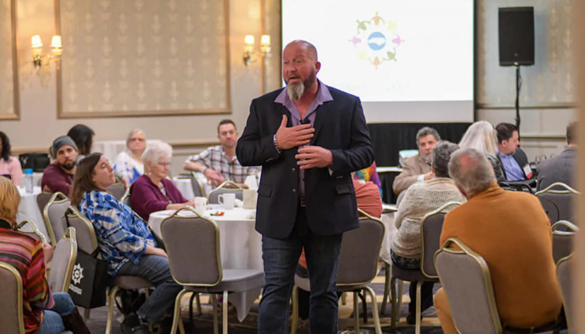 Teddy Lanier speaking at a conference. He struggled with an opioid addiction for 17 years. (Tony Shivers, Still Smiling Photography)
