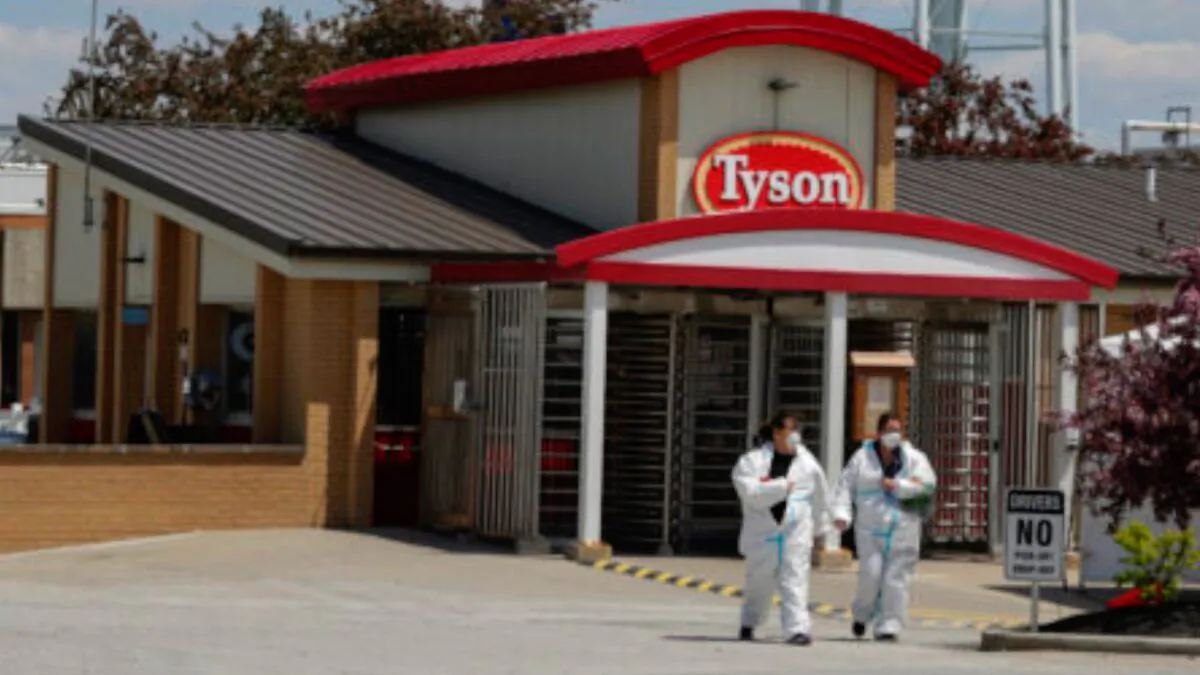 Workers leave the Tyson Foods pork processing plant in Logansport, Ind., on May 7, 2020. (Michael Conroy/AP Photo)