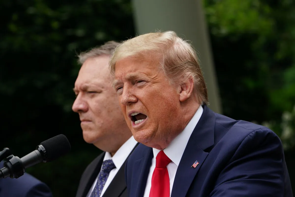 President Donald Trump, with Secretary of State Mike Pompeo, holds a press conference on China in the Rose Garden of the White House in Washington, on May 29, 2020. (Mandel Ngan/AFP via Getty Images)
