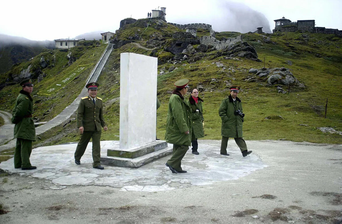 Chinese soldiers at the Nathu La Pass area at the India–China border in the northeastern Indian state of Sikkim in August 2003. The two sides had a minor face-off at another pass called Naku La on Jan. 20, 2021, according to the Indian army. (STR/AFP via Getty Images)
