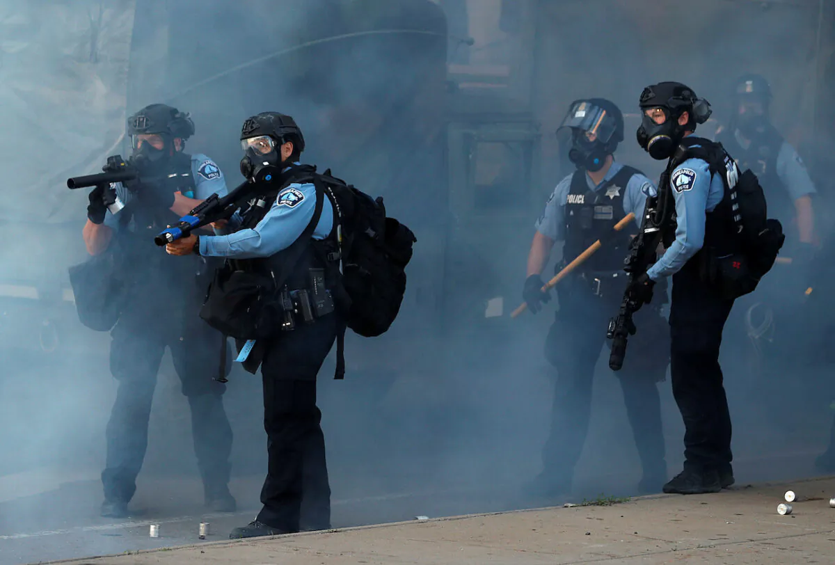 Police officers are seen during a protest against the death in Minneapolis police custody of African-American man George Floyd, in Minneapolis, Minn., on May 29, 2020. (Lucas Jackson/Reuters)