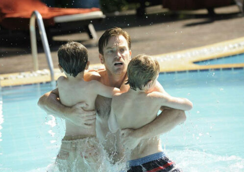 dad clutches his sons
