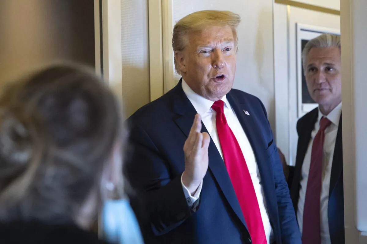 President Donald Trump, with House Minority Leader Kevin McCarthy (R-Calif.), speaks with reporters while in air en route to Andrews Air Force Base in flight on May 30, 2020. (Alex Brandon/AP Photo)