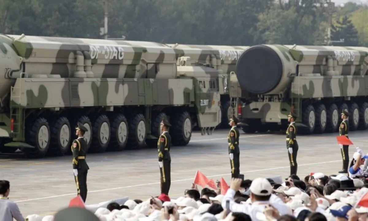 Military vehicles carrying intercontinental ballistic missiles DF-31AG travel past Tiananmen Square during the military parade marking the 70th founding anniversary of People's Republic of China, on its National Day in Beijing, China, on October 1, 2019. (File Photo)