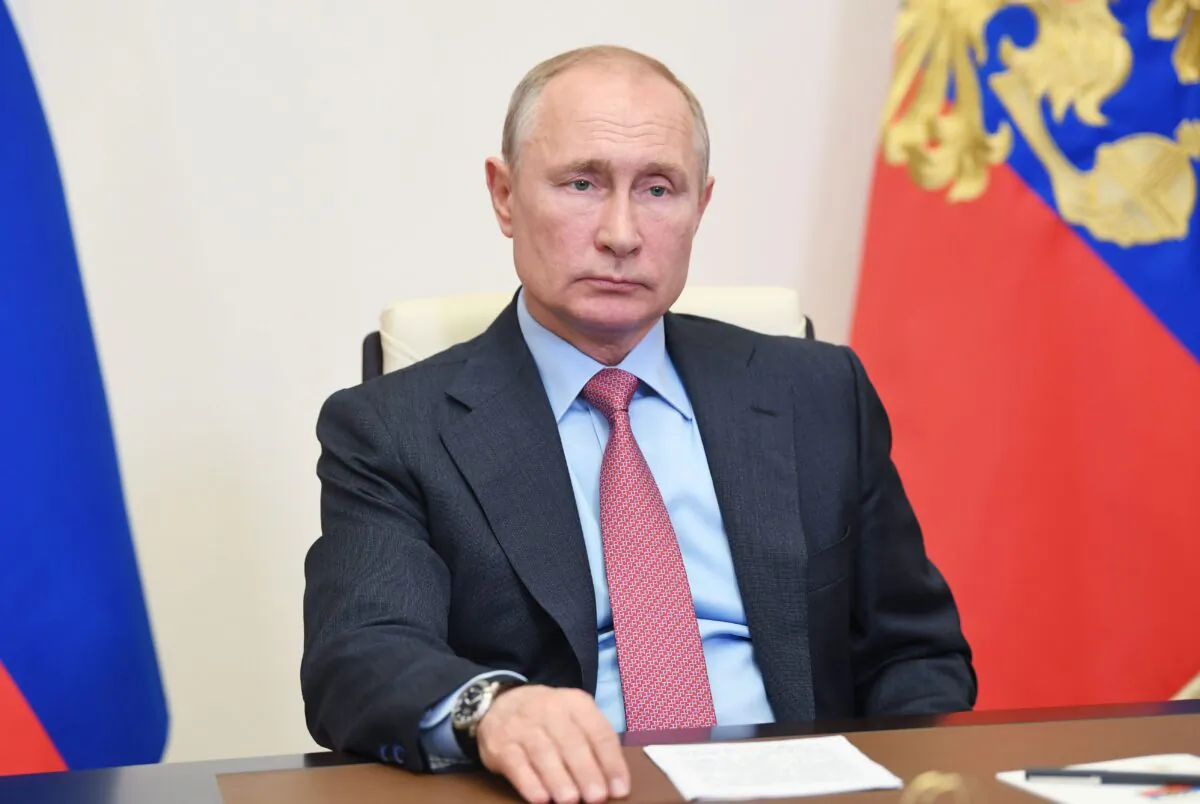 Russian President Vladimir Putin attends a meeting with Moscow Mayor to discuss the epidemiological situation in the Russian capital, via a teleconference call at Novo-Ogaryovo state residence, outside Moscow, Russia, on May 27, 2020. (Aleksey Nikolskyi / various sources / SPUTNIK/AFP via Getty Images)