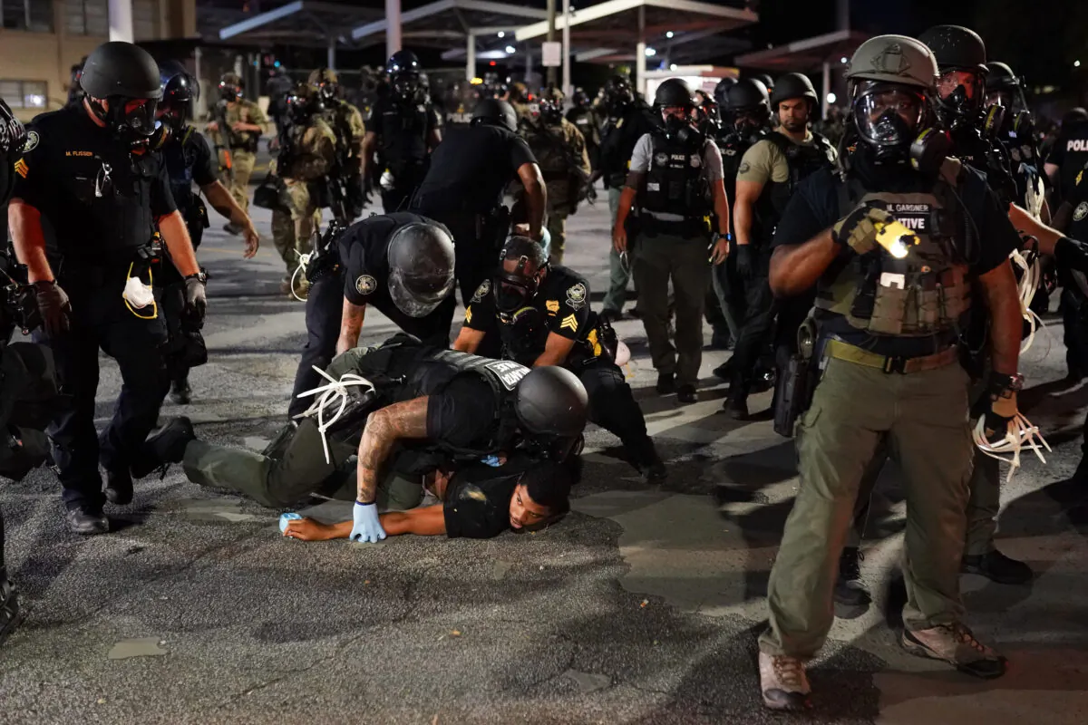 Police detain a protester during a protest in Atlanta, Ga., on May 30, 2020. (Elijah Nouvelage/Getty Images)