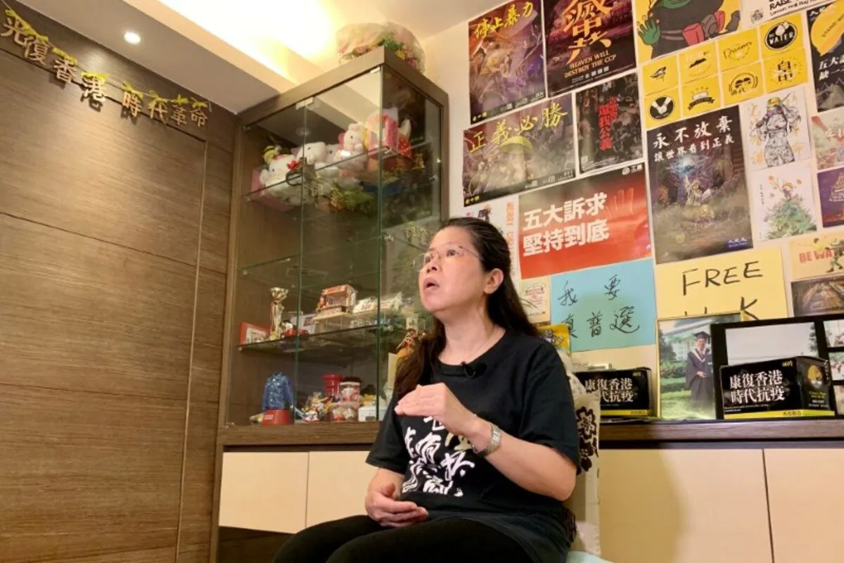 Office worker Daisy Lam speaks to Reuters about her experience in joining the annual June 4 candlelight vigil, at her living room in Hong Kong, China, on June 1, 2020. (Yoyo Chow/Reuters)