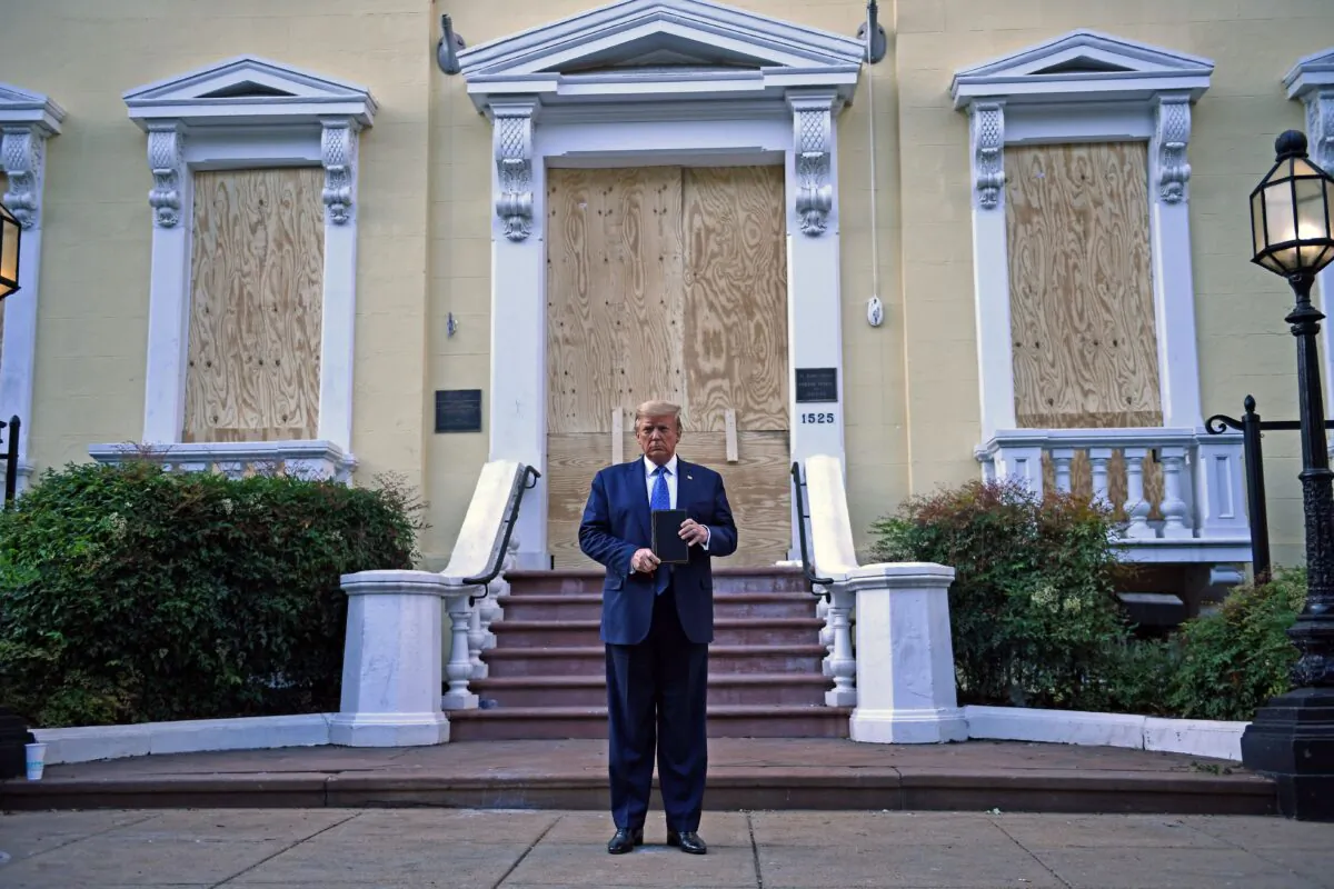 President Donald Trump holds up a Bible outside St. John's Episcopal Church across Lafayette Park in Washington on June 1, 2020. (Brendan Smialowski/AFP via Getty Images)