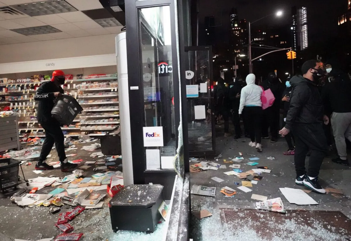 People loot a store during demonstrations over the death of George Floyd by a Minneapolis police officer in New York on June 1, 2020. (Bryan R. Smith/AFP via Getty Images)