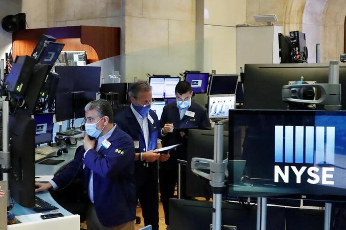 Traders wear masks as they work on the floor of the New York Stock Exchange as the outbreak of the CCP virus continues in the Manhattan borough of New York, on May 27, 2020. (Lucas Jackson/Reuters)