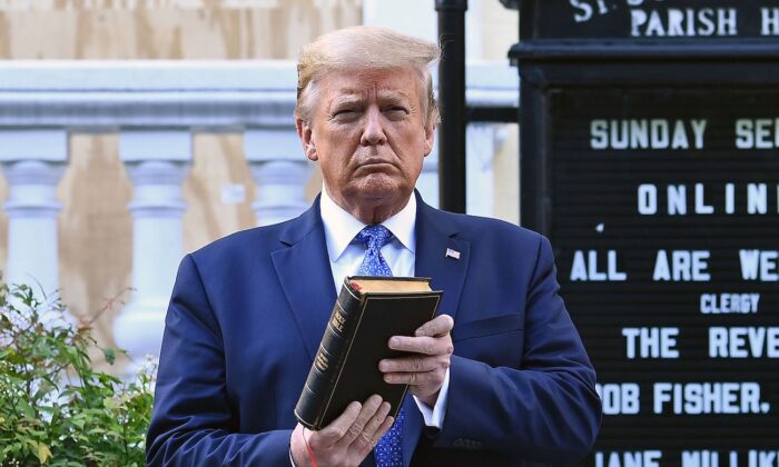 President Donald Trump holds up a Bible outside of St John's Episcopal church across Lafayette Park in Washington, on June 1, 2020. (Brendan Smialowski/AFP via Getty Images)