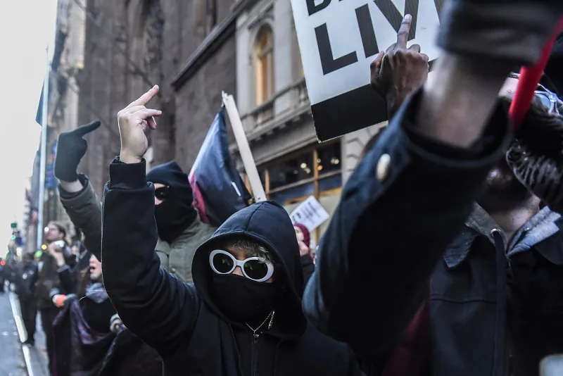 “Anti-fascists” wearing black bloc style clothing protest in New York City on Nov. 16, 2019. (Stephanie Keith/Getty Images)