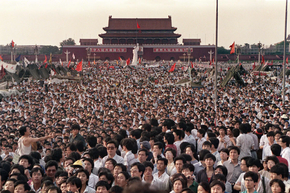 Hundreds of thousands of Chinese citizens gather in Tiananmen Square around a 10-meter replica of the Statue of Liberty, called the Goddess of Democracy, on June 2, 1989. (Catherine Henriette/AFP via Getty Images)