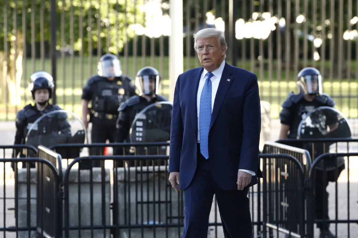 President Donald Trump walks in Lafayette Park in Washington, on June 1, 2020. (AP Photo/Patrick Semansky)