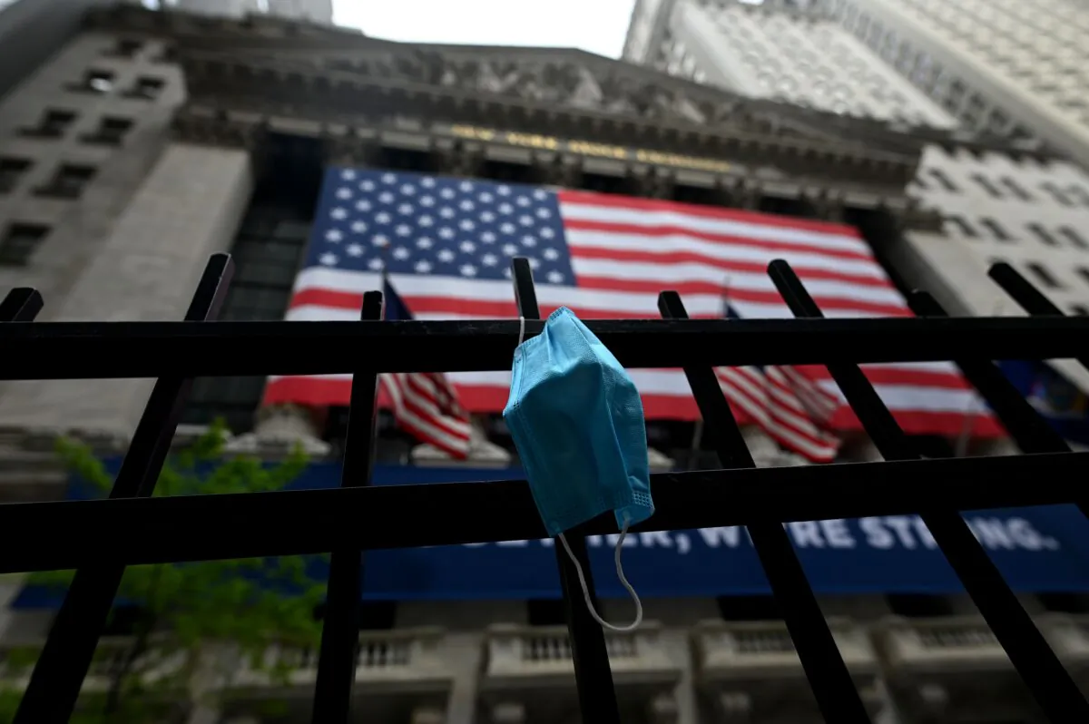 A face mask is seen in front of the New York Stock Exchange (NYSE) at Wall Street in New York City, on May 26, 2020. (Johannes Eisele /AFP/Getty Images)