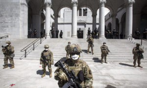 Armed Man Dressed in Military Fatigues Arrested During Riots