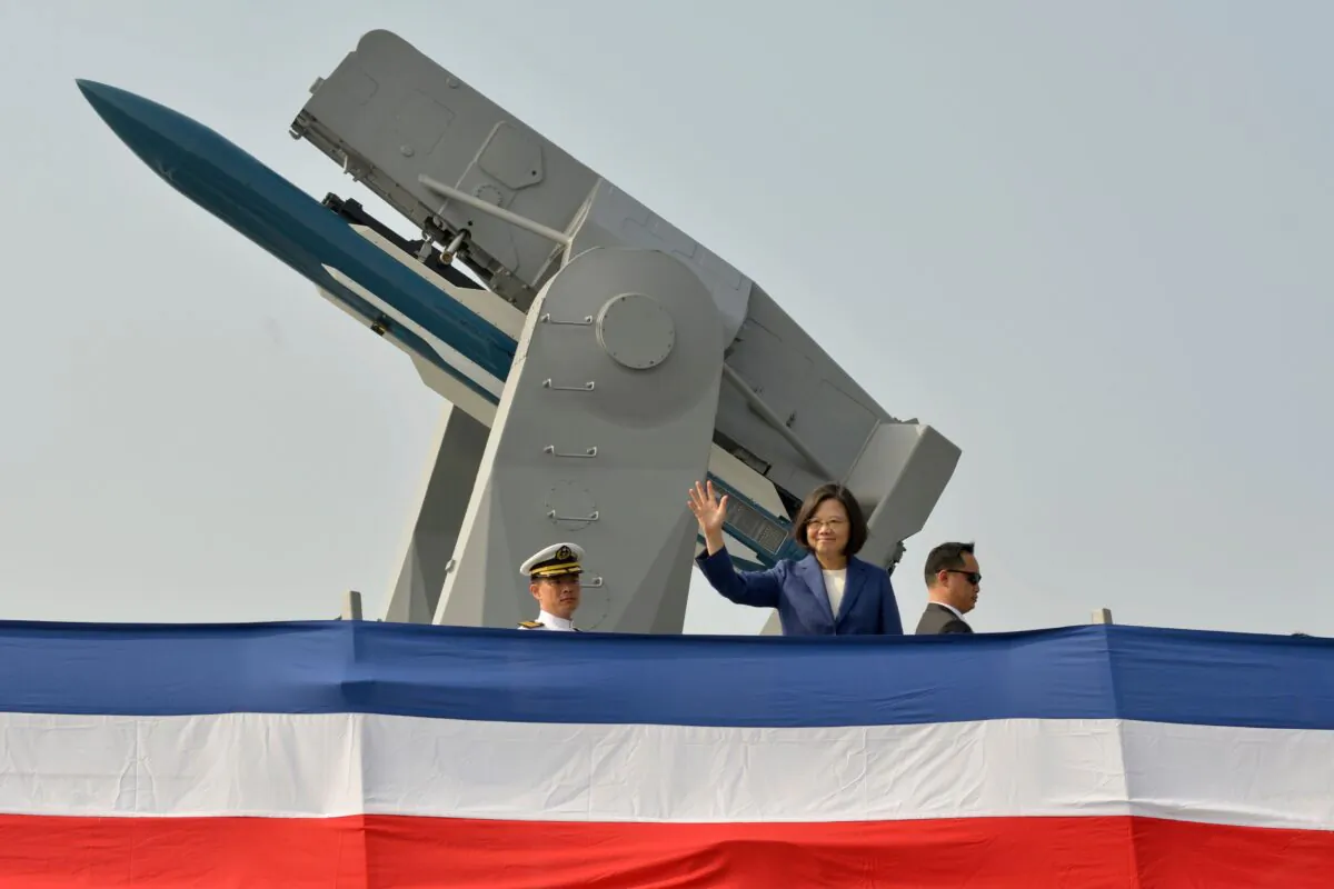 Taiwan's President Tsai Ing-wen (C) waves from the deck of the Ming Chuan frigate during a ceremony to commission two Perry-class guided missile frigates from the United States into the Taiwan Navy, in the southern port of Kaohsiung on Nov. 8, 2018. (Chris Stowers/AFP via Getty Images)