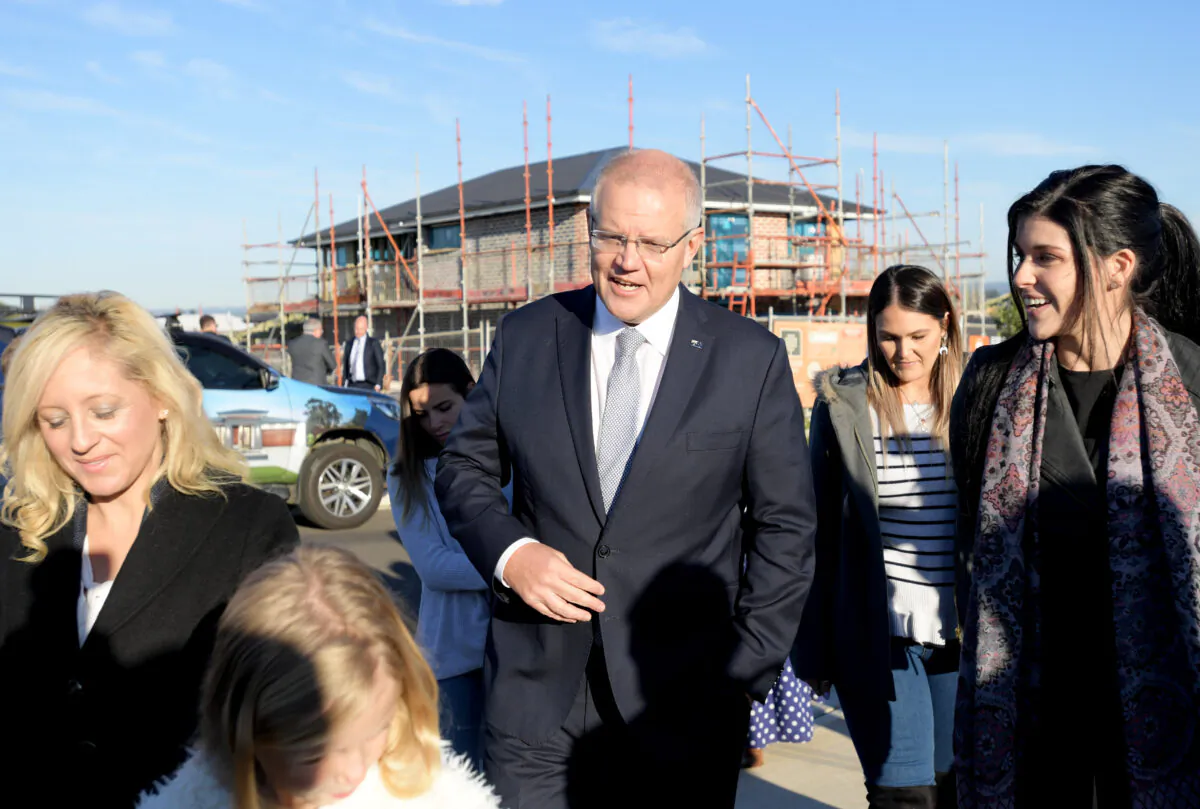 Prime Minister Scott Morrison with the Liberal candidate for Lindsay Melissa McIntosh (L) and first home buyers visits a housing estate in Caddens on May 13, 2019 in Sydney, Australia. (Tracey Nearmy/Getty Images)