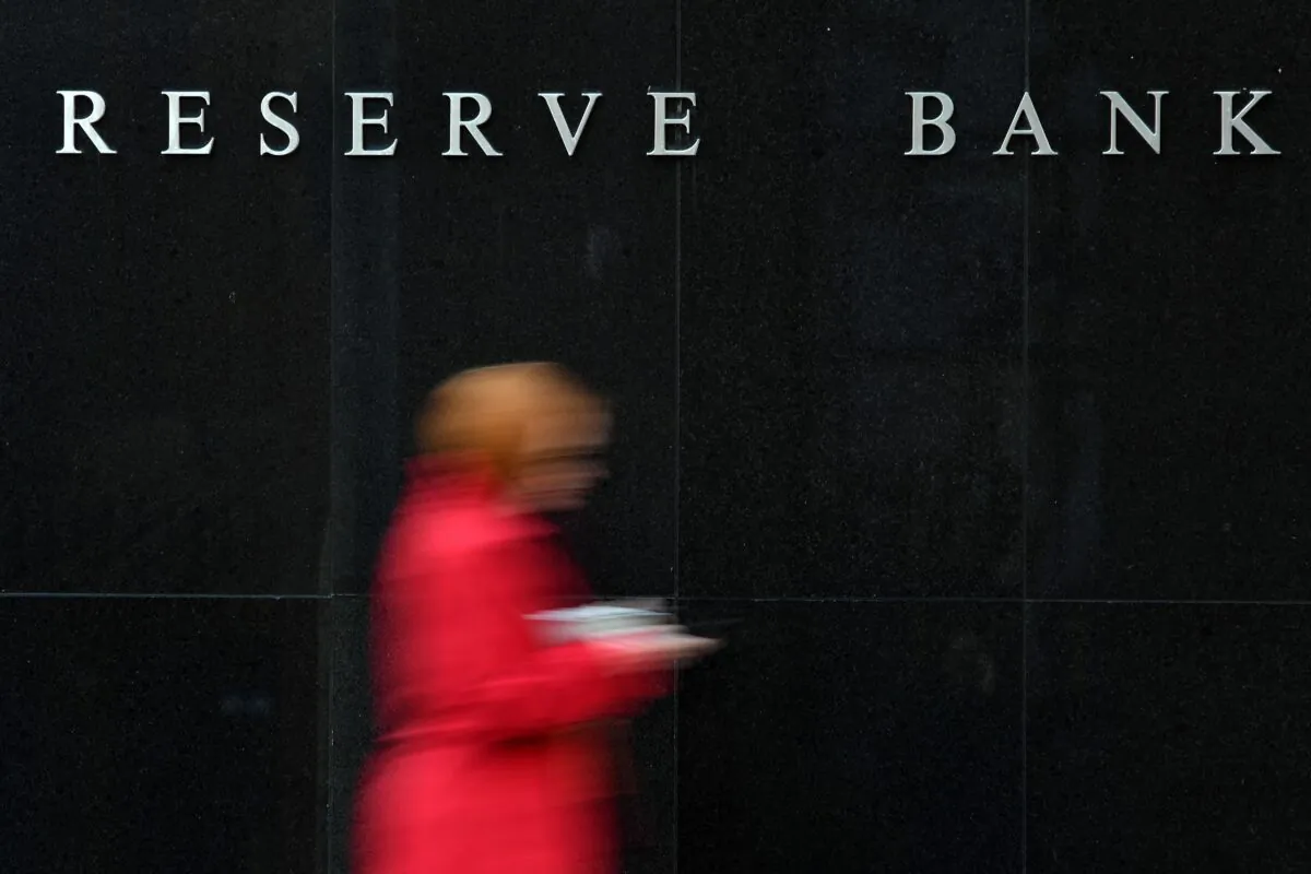 People walk past the Reserve Bank of Australia building in Sydney, Australia, on May 7, 2019. (SAEED KHAN/AFP via Getty Images)