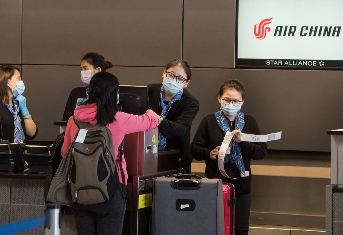 Chinese citizens check in to their Air China flight to Beijing, at Los Angeles International Airport in California, U.S. on Feb. 2, 2020. (MARK RALSTON/AFP via Getty Images)