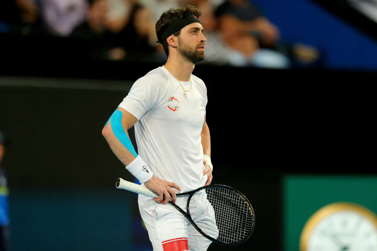 Nikoloz Basilashvili of Team Georgia waits as Pablo Cuevas of Team Uruguay argues with the referees during day six of the 2020 ATP Cup Group Stage at RAC Arena in Perth, Australia, on Jan. 8, 2020. (James Worsfold/Getty Images)