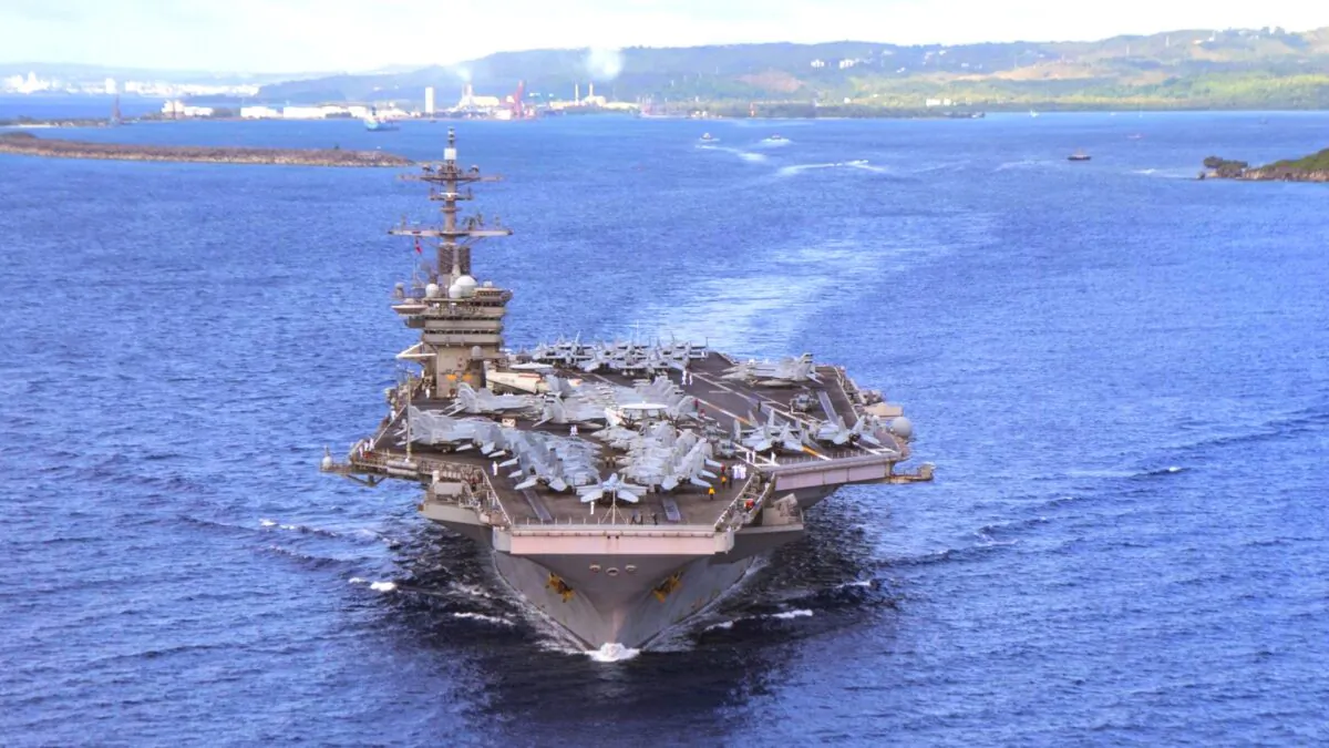 The US Navy aircraft carrier USS Theodore Roosevelt (CVN 71) departs Apra Harbor in Guam on June 4, 2020. (Mass Communication Specialist Seaman Kaylianna Genier/U.S. Navy via AP)