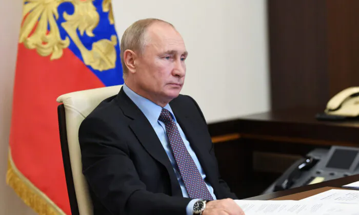 Russia's President Vladimir Putin takes part in a video conference call with representatives of environmental and animal protection public organizations, at the Novo-Ogaryovo state residence outside Moscow, Russia, on June 5, 2020. (Alexei Nikolsky/Sputnik/Kremlin via Reuters)