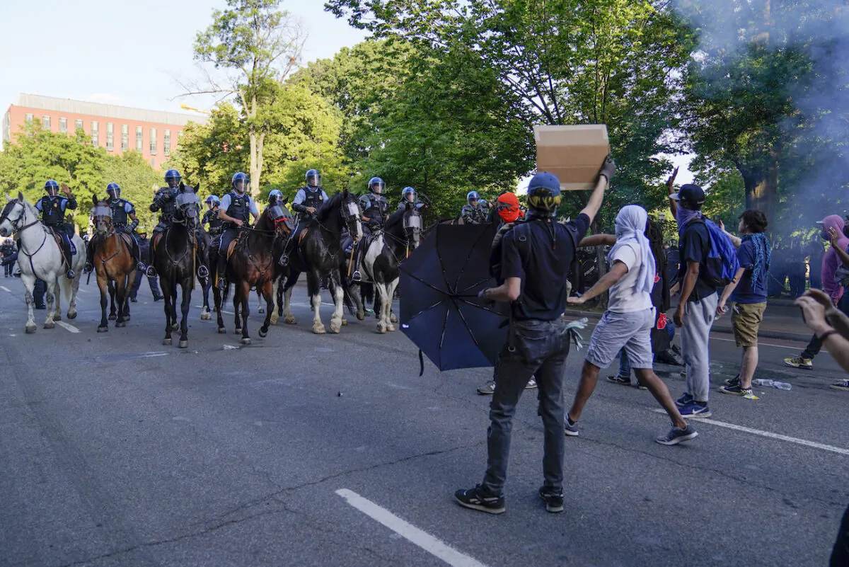 Police on horseback begin to approach demonstrators who had gathered to protest the death of George Floyd, near the White House in Washington on June 1, 2020. (Evan Vucci/AP Photo)