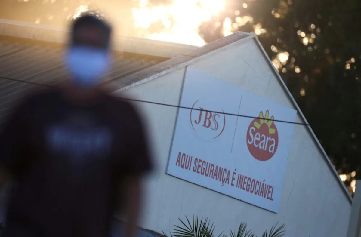 A JBS SA's poultry factory employee is pictured after the company was hit by an outbreak of COVID-19, in Passo Fundo, state of Rio Grande do Sul, Brazil, on April 24, 2020. (Diego Vara/Reuters, File Photo)