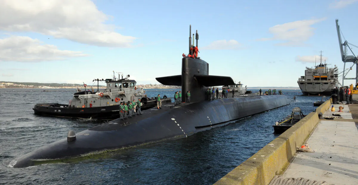 The guided-missile submarine USS Ohio (SSGN 726) prepares to moor at Naval Magazine Indian Island. Ohio recently completed a 14-month forward deployment to the U.S. 7th Fleet area of responsibility. (U.S. Navy)