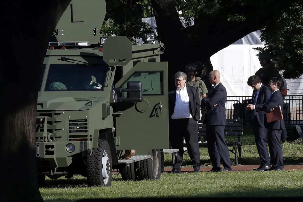 Attorney General William Barr stands in Lafayette Park across from the White House in Washington on June 1, 2020. (AP Photo/Alex Brandon)