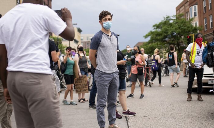 Minneapolis Mayor Jacob Frey looks over a demonstration calling for the Minneapolis Police Department to be defunded in Minneapolis, Minn., on June 6, 2020. Frey spoke at the head of the march but was asked to leave by the organizers after declining to commit to fully defunding the MPD. (Stephen Maturen/Getty Images)