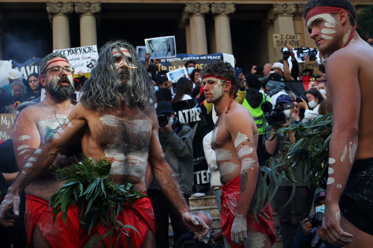 Aboriginal protesters conduct a traditional smoking ceremony at Town Hall during a protest march, Sydney, Australia, on June 6, 2020. (Lisa Maree Williams/Getty Images)
