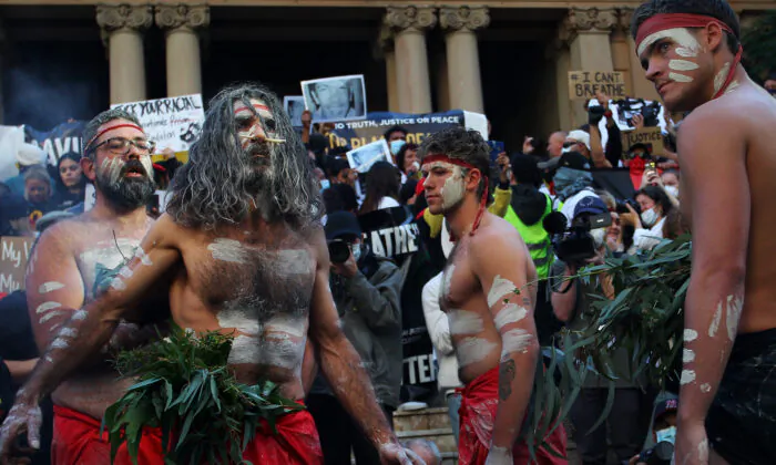 Aboriginal protesters conduct a traditional smoking ceremony at Town Hall during a protest march, Sydney, Australia, on June 6, 2020. (Lisa Maree Williams/Getty Images)