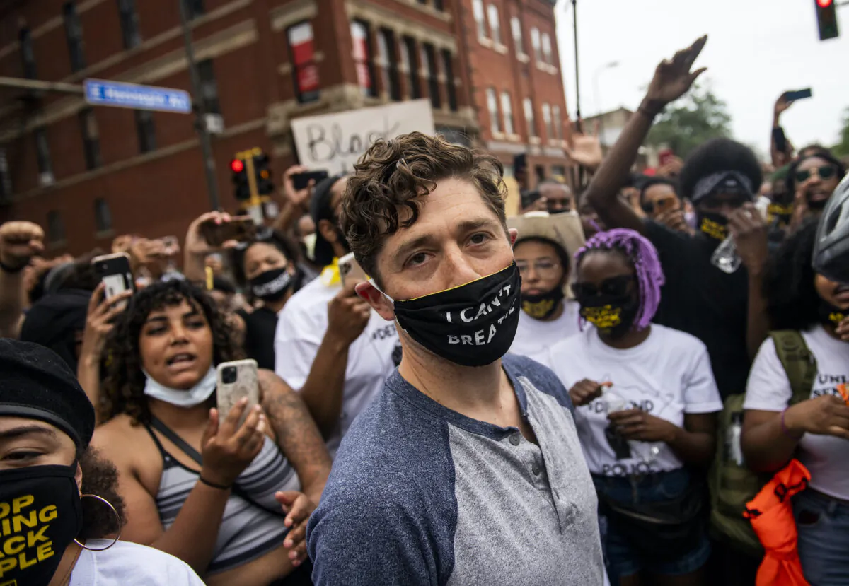 Minneapolis Mayor Jacob Frey leaves after coming out of his home to speak during a demonstration calling for the Minneapolis Police Department to be defunded, in Minneapolis, Minn., on June 6, 2020. Mayor Frey declined when he was asked if he would fully defund the police and was then asked to leave the protest. (Stephen Maturen/Getty Images)